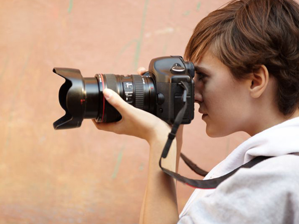 standing photograph freelancer camera