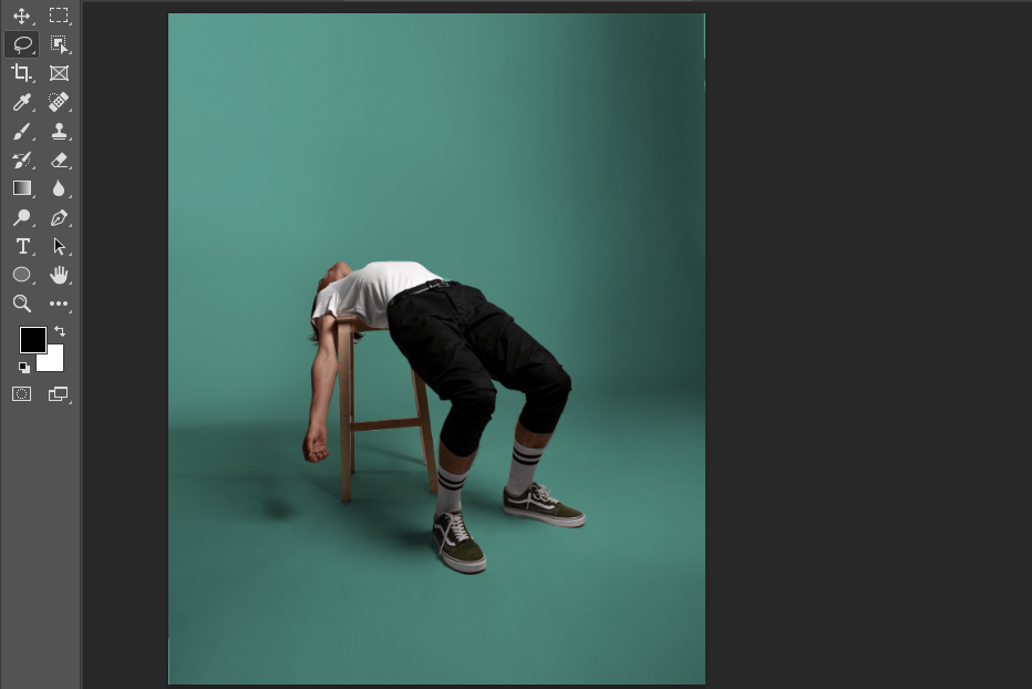 Men bent backwards over a stool